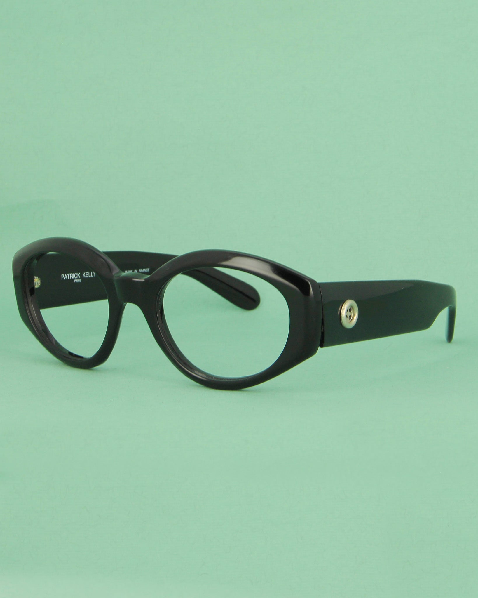 Patrick Kelly Papaye lunettes de soleil ovales noires