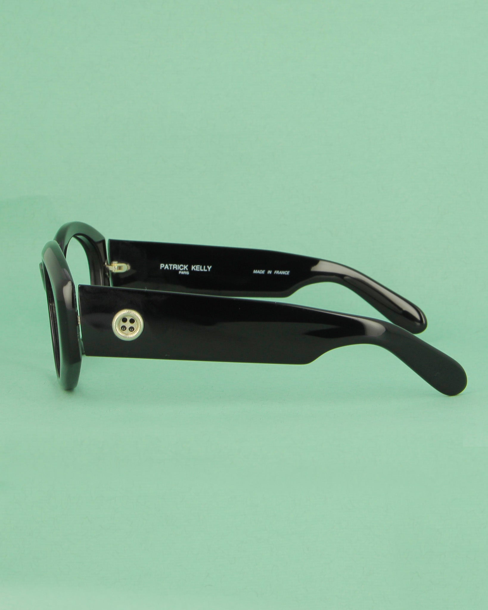 Patrick Kelly Papaye lunettes de soleil ovales noires
